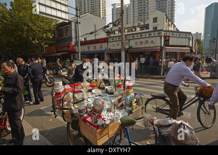 A mobile shop on the back of a bicylce, in a street scene along Xizang Rd, in Shanghai, China. Stock Photo