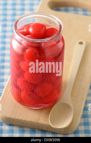 Jar of stewed cherries in syrup Stock Photo