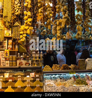 Sponges, tea and sweets in busy Turkish market stall Stock Photo