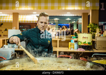 Barcelona, Spain. March 31st, 2014: An employee prepares lunch for the visitors of the 20th edition of the 'Alimentaria' in Barcelona at the Aneto stand Credit:  matthi/Alamy Live News Stock Photo