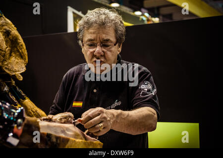 Barcelona, Spain. March 31st, 2014: An master cutter slices 'Jamon serrano' for the visitors of the 20th edition of the Alimentaria in Barcelona Credit:  matthi/Alamy Live News Stock Photo