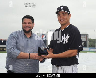 Tampa, Florida, USA. 29th Mar, 2014. (L-R) Mark Feinsand, Masahiro Tanaka (Yankees) MLB : Masahiro Tanaka of the New York Yankees receives the 2014 James P. Dawson Award, given annually to the outstanding Yankees rookie in spring training, from Mark Feinsand of the New York Daily News, representing the New York chapter of the Baseball Writers' Association of America, before a spring training baseball game against the Miami Marlins was rained out at George M. Steinbrenner Field in Tampa, Florida, United States . © AFLO/Alamy Live News Stock Photo