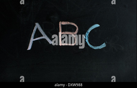 ABC colored chalk on blackboard. Stock Photo