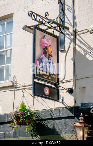 View of a traditional English pub sign hanging over the Saracens Head Tavern in Walcot Street, Bath, Somerset, England, UK. Stock Photo