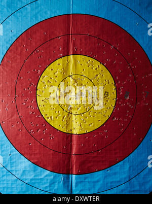 an archery target with lots of holes in it Stock Photo