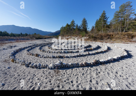 Mandala of stones on gravel bank on the river Isar, in Lenggries, Isarwinkel, Upper Bavaria, Bavaria, Germany Stock Photo