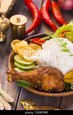 nasi ayam penyet, indonesian fried chicken rice Stock Photo