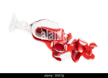 Broken glass of wine. Poured red wine, like blood. Isolated on white background. Studio shoot. Stock Photo