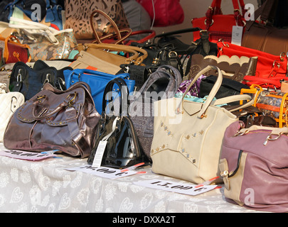 leather goods and handbags for sale at a flea market stall Stock