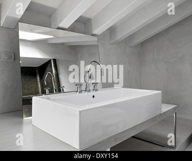 detail of washbasin in the modern bathroom in the attic room Stock Photo