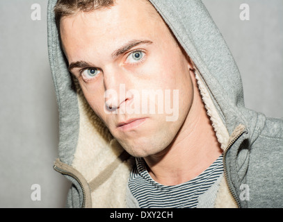 Moody male wearing hooded top Stock Photo
