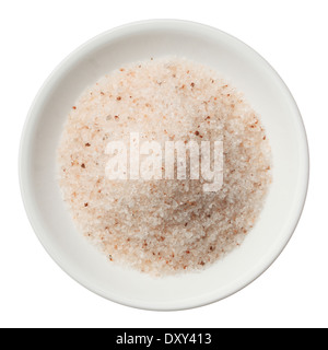 Himalayan pink salt pile in a plate isolated on white top view Stock Photo