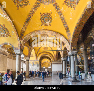 Upper South Gallery looking towards tourists gathered round Deisis mosaic, Hagia Sophia (Aya Sofya), Istanbul,Turkey Stock Photo