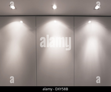 Wall with three light sources Stock Photo