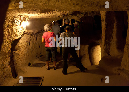People in Kaymakli underground city in Cappadocia Stock Photo
