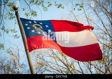 Georgia state flag unfurled in the wind on a beautiful Spring morning at Stone Mountain in Atlanta, Georgia, USA. Stock Photo