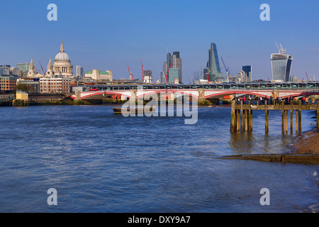 Wooden pier at Oxo Tower Wharf on the River Thames with Blackfriars Bridge and the City of London skyline in London, England Stock Photo