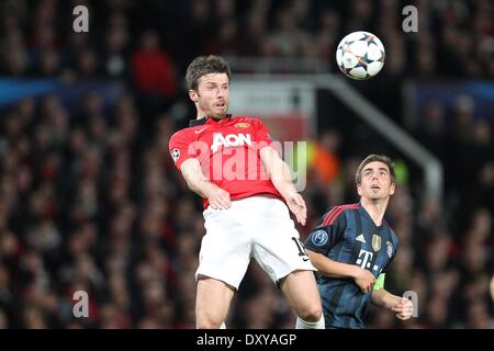 Manchester, UK. 1st April, 2014. Old Trafford, Manchester, England, UEFA Champions League quarter-final. Manchester United versus Bayern Munich. Michael Carrick 16 (Manchester United) and Philipp Lahm 21 (FC Bayern) Credit:  Action Plus Sports Images/Alamy Live News Stock Photo