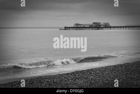 Hastings pier seen from the beach. Built in Victorian times and destroyed by fire in 2010. Stock Photo