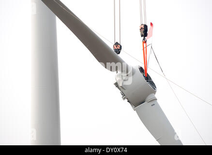 The wings of a wind turbine get mounted on 31 March 2014 in Visselhoevede. Stock Photo