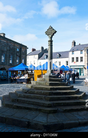 The Market Square and Stone Market Cross in the Town of Alnwick Northumberland England United Kingdom UK Stock Photo