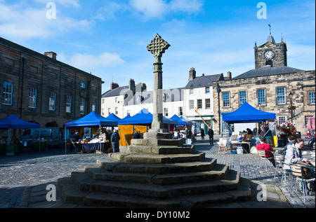 The Market Square and Stone Market Cross in the Town of Alnwick Northumberland England United Kingdom UK Stock Photo