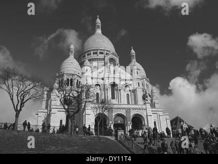 The Sacre-Coeur Basilica viewed from the bottom of steps in Montmartre, Paris in monochrome Stock Photo