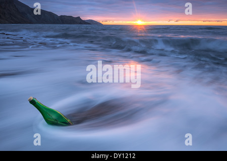 bottle with letter in sea water Stock Photo