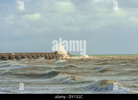 Stormy seas breaking over Brighton Marina, Sussex, UK Stock Photo