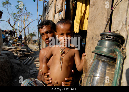 BANGLADESH District Bagerhat , cyclone Sidr and high tide destroy villages in South khali, father and his son Stock Photo