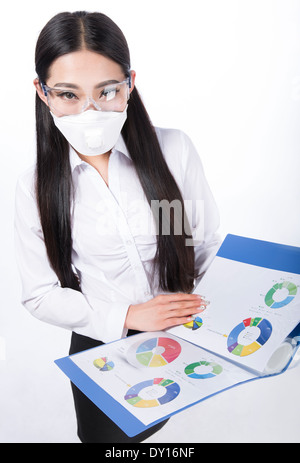 black hair girl with a mask on her face. Isolated on white Stock Photo