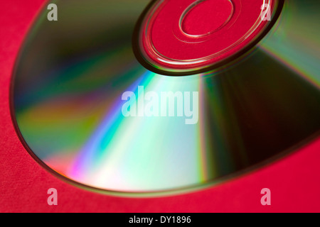 blank media disc on red background Stock Photo
