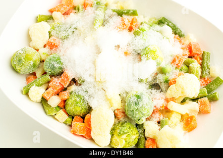 Mixture of frozen vegetables, carrots, peas, broccoli, green beans, Brussels sprouts, cauliflower Stock Photo