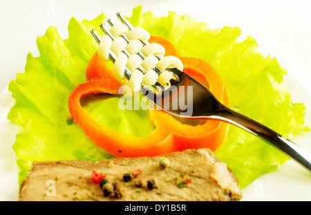 Beef with pasta, salad, sweet pepper on a plate. Stock Photo