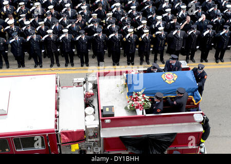Watertown, Massachusetts, USA. 2nd Apr, 2014. Thousands of firefighters from across the nation gathered outside the Church of Saint Patrick to attend the funeral of fallen Boston Firefighter Lieutenant Edward Walsh. Walsh and fellow firefighter Michael Kennedy died in a nine-alarm blaze at 298 Beacon Street in Boston, Massachusetts. Credit:  Nicolaus Czarnecki/METRO Boston/ZUMAPRESS.com/Alamy Live News Stock Photo