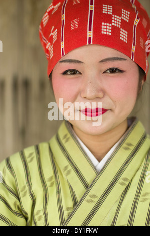 Young okinawan woman in traditional yukata at at Ryukyu Mura, Yomitan Village, Okinawa, Japan Stock Photo
