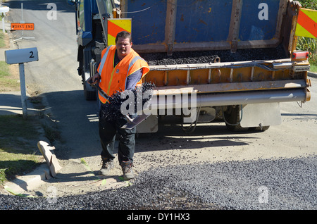 Road workers during paving ground roadwork construction of a new Stock ...