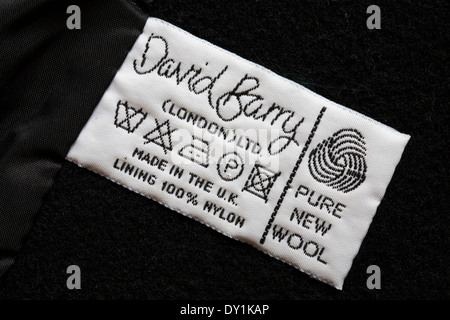 label in coat - David Barry (London) Ltd pure new wool made in the U.K. lining 100% nylon - care washing symbols and instructions Stock Photo