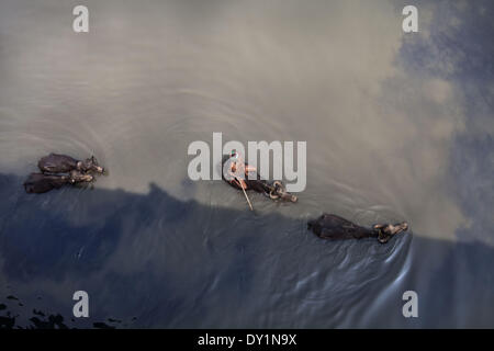 Dhaka, Bangladesh. 22nd Mar, 2014. Indiscriminate discharge of liquid waste by the tannaery industries of Dhaka's Hazaribagh area has ruined a large part of the Buriganga river, causing immense suffering to residents living on the banks. © Probal Rashid/NurPhoto/ZUMAPRESS.com/Alamy Live News Stock Photo