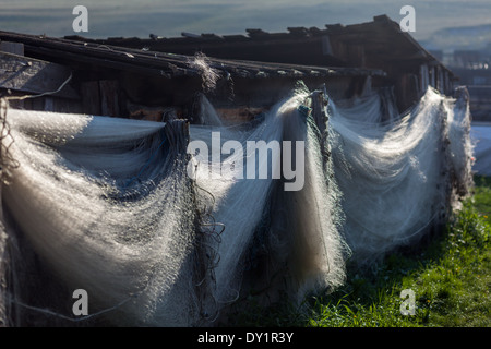 Fishing nets in Siberian village (Bolshoe Goloustnoe on the shore of Lake Baikal, Siberia, Russia) Stock Photo