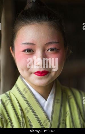 Young okinawan woman in traditional yukata at at Ryukyu Mura, Yomitan Village, Okinawa, Japan Stock Photo