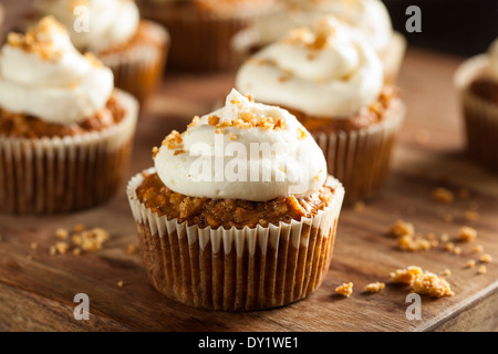 Homemade Carrot Cupcakes with Cream Cheese Frosting for Easter Stock Photo