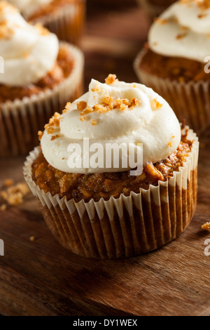 Homemade Carrot Cupcakes with Cream Cheese Frosting for Easter Stock Photo