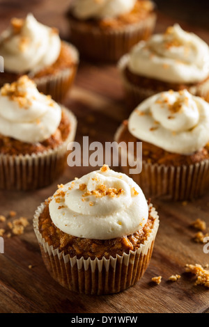 Homemade Carrot Cupcakes with Cream Cheese Frosting for Easter Stock Photo
