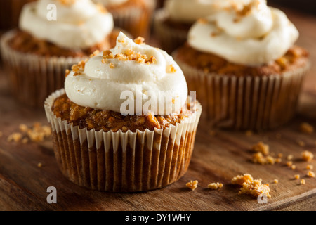 Homemade Carrot Cupcakes with Cream Cheese Frosting for Easter Stock Photo