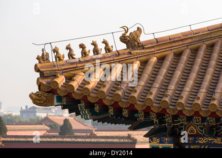 ASIA Beijing CHINA Detail Forbidden City Imperial roof decoration of highest status on the roof ridge of the Hall of Supreme Har Stock Photo