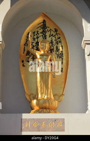 Golden statue on the Peace Pagoda, Buddhist Temple, Battersea London UK Stock Photo