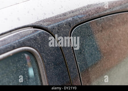 Liverpool, UK. 3rd April 2014. A car covered in Saharan sand in Liverpool on Thursday April 3rd, 2014. Smog created by a mix of pollution and Saharan dust passed over the region. Credit:  Peter Carr/Alamy Live News Stock Photo