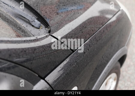 Liverpool, UK. 3rd April 2014. A car covered in Saharan sand in Liverpool on Thursday April 3rd, 2014. Smog created by a mix of pollution and Saharan dust passed over the region. Credit:  Peter Carr/Alamy Live News Stock Photo