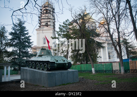 Flame-thrower tank OT-34 on monument of World War II and The Church of St. Alexander Nevsky in Simferopol, Crimea Stock Photo